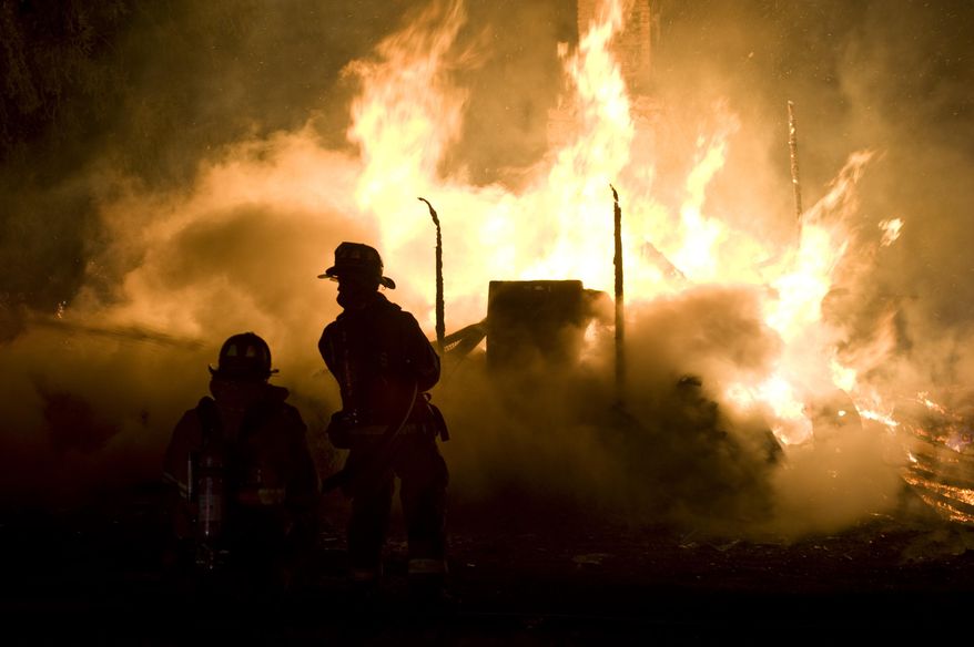 Firefighters try to put out a early morning fire on Friday, April 4, 2014 outside Danville, Pa. The early morning farmhouse fire in north-central Pennsylvania killed three children, ages 2 to 13, authorities said. The Northumberland County coroner identified the victims as 13-year old Daniel Dissinger, 7-year old Gavin Dissinger and 2-year old Arthur Dissinger. The deaths were ruled accidental. The children's mother was at work at the time of the fire, Kriner said. He said a 13-year-old boy and 14-year-old girl managed to escape from the home and were treated for injuries that weren't life-threatening. Another child was staying at a friend's house overnight, he said. The home had almost completely collapsed by the time the first crews arrived, officials said. (AP Photo/The News-Item, Larry Deklinski)
