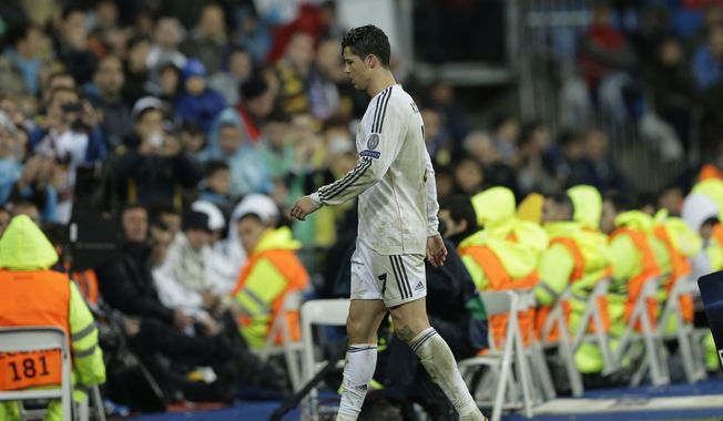 Real's Cristiano Ronaldo leaves the game during a Champions League quarterfinal first leg soccer match between Real Madrid and Borussia Dortmund at the Santiago Bernabeu   stadium in Madrid, Spain, Wednesday April 2, 2014. (AP Photo/Paul White)