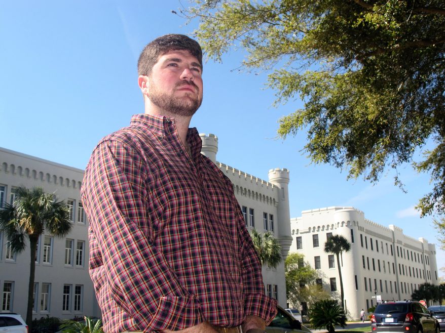 Andrew Kispert, a 27-year-old Marine veteran who is now attending The Citadel, poses on the campus of the military college in Charleston, S.C., on Friday, April 4, 2014. Over the next few years thousands of veterans are expected to attend college as the wars in Iraq and Afghanistan wind down and the military downsizes. (AP Photo/Bruce Smith)