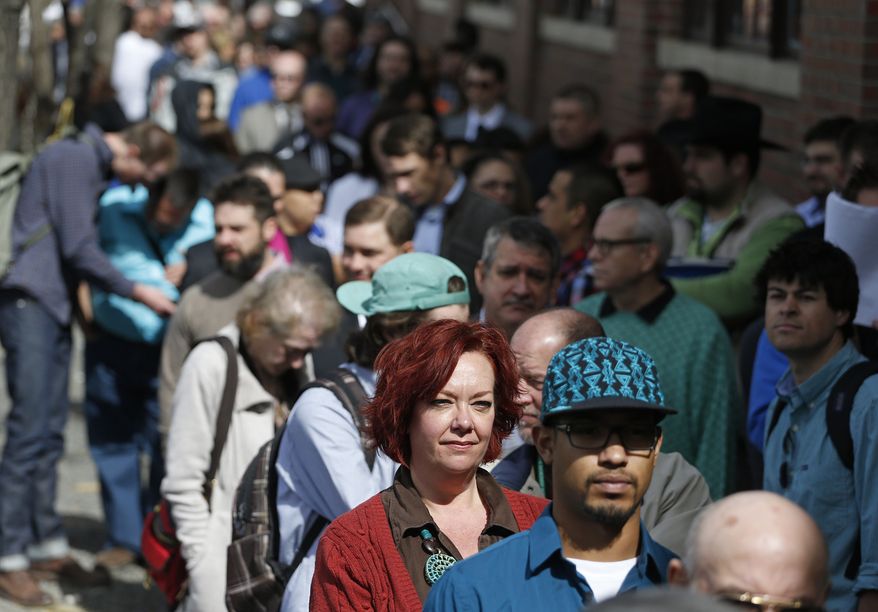** FILE ** In this Thursday March 13, 2014, file photo, job seekers line up to attend a marijuana industry job far in Downtown Denver. (AP Photo/Brennan Linsley, File)