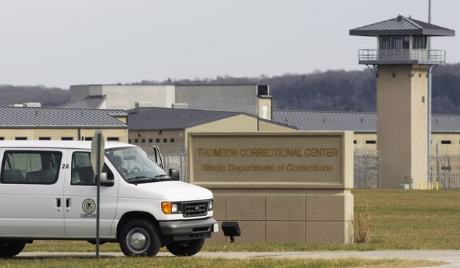 In this May 21, 2010, file photo, a van drives past the Thomson Correctional Center in Thomson, Ill. (AP Photo/M. Spencer Green, File)