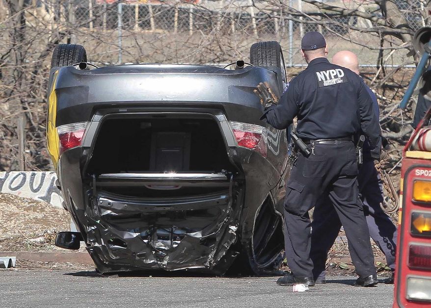 Police recover a 2009 Honda Accord that tumbled into the Steinway Creek on Saturday April 5, 2014 in New York. The driver of the car drove off a dead-end street in a desolate industrial area, flipped over a wooden curb into the East River inlet killing four passengers. The driver escaped serious injury and told officers at the scene in the Astoria section of Queens that the four were trapped in the submerged car. Fire department divers pulled the four victims from the car. Police identified them as 21-year-old Darius Fletcher, 19-year-old Jada Monique Butts, 19-year-old Crystal Gravely and 20-year-old Jaleel Furtado. They were pronounced dead at hospitals. (AP Photo/Bebeto Matthews)