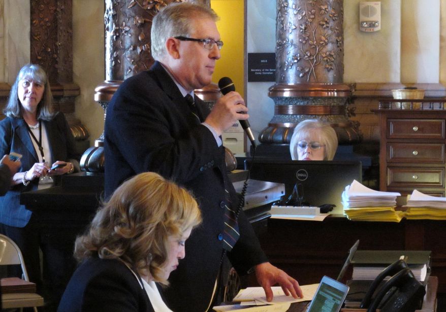 Republican party Kansas state Sen. Clark Shultz, of McPherson, Kan. explains a bill making technical changes in Kansas anti-abortion laws during the Senate's session at the Statehouse in Topeka, Kan. on Saturday, April 5, 2014. Lawmakers passed the bill and avoided a debate over more controversial abortion proposals. (AP Photo/John Hanna)