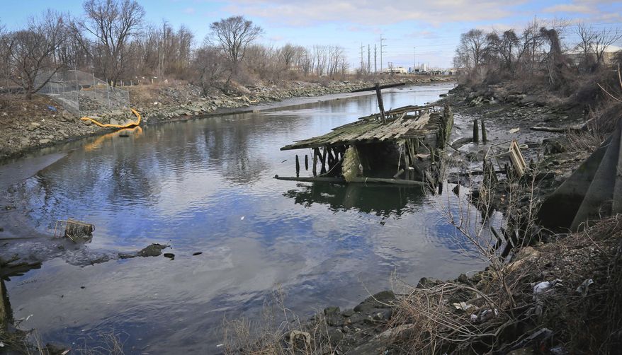 This Saturday, April 5, 2014 photo shows Steinway Creek shortly after police recovered a 2009 Honda Accord from its waters in New York. The driver of the car drove off a dead-end street in a desolate industrial area, flipped over a wooden curb into the East River inlet killing four passengers. The driver escaped serious injury and told officers at the scene in the Astoria section of Queens that the four were trapped in the submerged car. Fire department divers pulled the four victims from the car. Police identified them as 21-year-old Darius Fletcher, 19-year-old Jada Monique Butts, 19-year-old Crystal Gravely and 20-year-old Jaleel Furtado. They were pronounced dead at hospitals. (AP Photo/Bebeto Matthews)