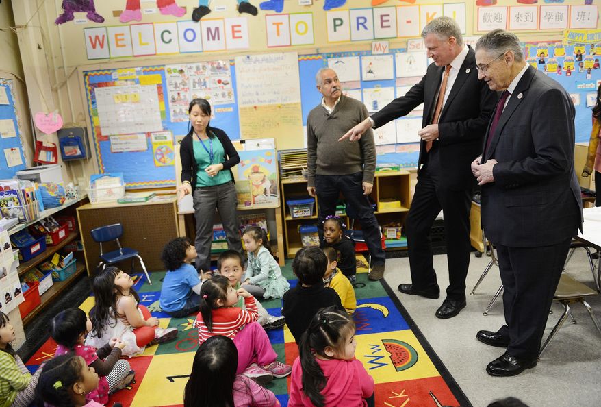 FILE - In this April 3, 2014 file photo, New York Mayor Bill de Blasio, second right, and State Assembly Speaker Sheldon Silver, right, visit a pre-kindergarten classroom at P.S.1 in New York. Now that the mayor has secured $300 million to put 4-year-olds in school, his administration must quickly find enough good teachers and classrooms to offer full-day pre-kindergarten for 53,000 children by September and another 20,000 by September, 2015. (AP Photo/New York Daily News, Susan Watts, Pool, File)