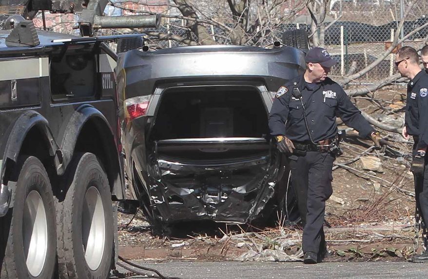 Police recover a 2009 Honda Accord that tumbled into the Steinway Creek on Saturday April 5, 2014 in New York. The driver of the car drove off a dead-end street in a desolate industrial area, flipped over a wooden curb into the East River inlet killing four passengers. The driver escaped serious injury and told officers at the scene in the Astoria section of Queens that the four were trapped in the submerged car. Fire department divers pulled the four victims from the car. Police identified them as 21-year-old Darius Fletcher, 19-year-old Jada Monique Butts, 19-year-old Crystal Gravely and 20-year-old Jaleel Furtado. They were pronounced dead at hospitals. (AP Photo/Bebeto Matthews)