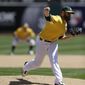Oakland Athletics&#39; Dan Straily works against the Seattle Mariners in the first inning of a baseball game on Saturday, April 5, 2014, in Oakland, Calif. (AP Photo/Ben Margot)