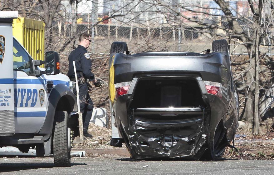 Police recover a 2009 Honda Accord that tumbled into the Steinway Creek on Saturday April 5, 2014 in New York. The driver of the car drove off a dead-end street in a desolate industrial area, flipped over a wooden curb into the East River inlet killing four passengers. The driver escaped serious injury and told officers at the scene in the Astoria section of Queens that the four were trapped in the submerged car. Fire department divers pulled the four victims from the car. Police identified them as 21-year-old Darius Fletcher, 19-year-old Jada Monique Butts, 19-year-old Crystal Gravely and 20-year-old Jaleel Furtado. They were pronounced dead at hospitals. (AP Photo/Bebeto Matthews)
