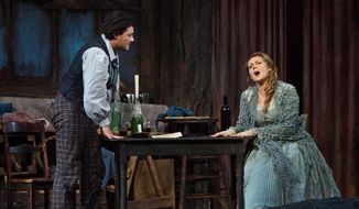 In this photo provided by the Metropolitan Opera, Vittorio Grigolo portrays Rodolfo with Kristine Opolais as Mimi in the Metropolitan Opera&#39;s Live in HD broadcast of Puccini&#39;s &amp;quot;La Boheme,&amp;quot; Saturday, April 5, 2014 in New York. Opolais made Metropolitan Opera history Saturday, stepping in for an ailing soprano to make her second company role debut in a span of 24 hours. On Friday night, Opolais sang Cio-Cio-San in Puccini&#39;s &amp;quot;Madama Butterfly.&amp;quot; (AP Photo/Metropolitan Opera, Marty Sohl)