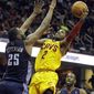 Cleveland Cavaliers&#x27; Kyrie Irving (2) shoots against Charlotte Bobcats&#x27; Al Jefferson (25) in the second quarter of an NBA basketball game on Saturday, April 5, 2014, in Cleveland. (AP Photo/Mark Duncan)
