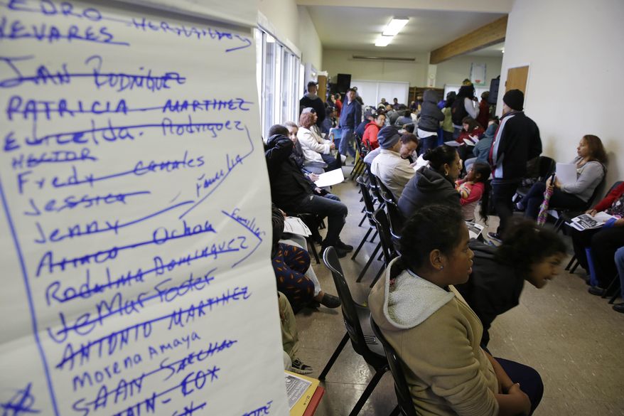 FILE - This March 31, 2014, file photo, shows a waiting filled with applicants waiting to be called during a health care enrollment event at the Bay Area Rescue Mission in Richmond, Calif. Seven million sign-ups proves there's an appetite in the country for President Barack Obama's health care law, but it doesn't guarantee success for America's newest social program. The top priorities for the administration now guaranteeing that premiums remain affordable next year, making enrollment simpler, and improving subpar customer service. Republican opponents also face some tough questions: as millions of people get insurance, how long can the GOP's repeal strategy remain a viable political option? (AP Photo/Eric Risberg, File)