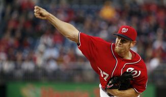 Washington Nationals starting pitcher Stephen Strasburg throws during the first inning of a baseball game against the Atlanta Braves at Nationals Park on Saturday, April 5, 2014, in Washington. (AP Photo/Alex Brandon)