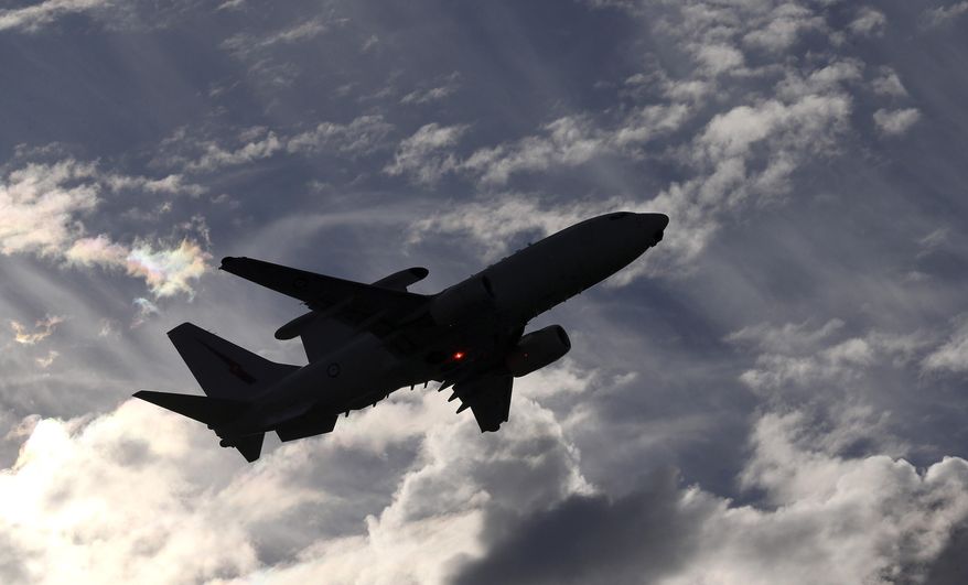 A Royal Australian Air Force E-7A Wedgetail takes off from Perth Airport on route to conduct search operations for missing Malaysia Airlines Flight MH370 in southern Indian Ocean, near the coast of Western Australia, Saturday, April 5, 2014. (AP Photo/Rob Griffith)