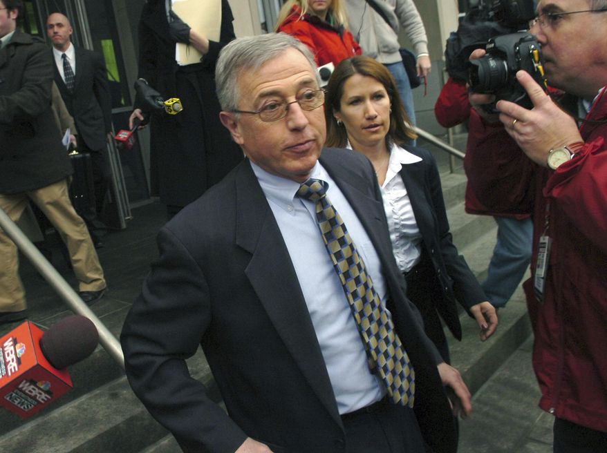 FILE - In this Feb. 12, 2009 file photo, former judge Mark Ciavarella, center, leaves the federal courthouse in Scranton, Pa. Ciavarella is serving a 28-year sentence and fellow ex-judge Michael Conahan 17 years for taking $2.6 million from companies looking to build and fill a youth detention center for Luzerne County. Ciavarella's daughter and one of the teens he sent away have formed an unlikely friendship and are now pondering ways to help troubled youth. (AP Photo/David Kidwell, File)