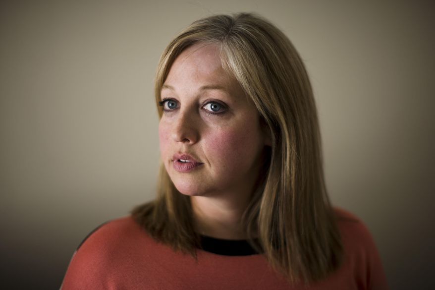 In this Tuesday, March 11, 2014 photo, Lauren Ciavarella Stahl poses for a photograph in Plymouth, Pa. Stahl is daughter of disgraced judge Mark Ciavarella who is serving a 28-year prison term for taking secret "finder's fees" from juvenile center officials in northeast Pennsylvania. Stahl recently met with Hillary Transue who was sent to juvenile detention at age 15 by Ciavarella. (AP Photo/Matt Rourke)