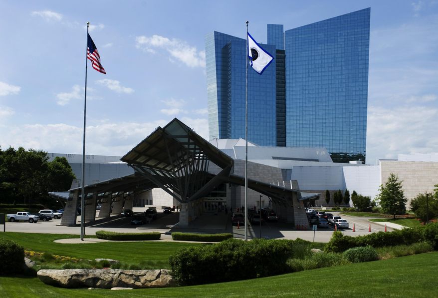 This June 10, 2012 photo shows the Mohegan Sun casino in Uncasville, Conn. A gaming slump is eating into the profits of Mohegan Sun in 2014, but the 2,000 tribal members who draw benefits from the massive casino are not feeling the pinch. The tribe’s gaming company has begun running casinos in Pennsylvania and Atlantic City, and it is pursuing more projects in states including Washington, New York, and Massachusetts. (AP Photo/Jessica Hill)