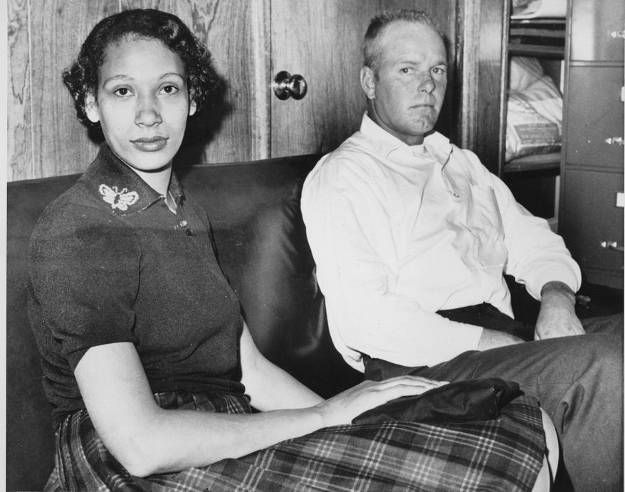 FILE - This Jan. 26, 1965 file photo shows Mildred Loving, a black woman, and her husband, Richard P. Loving, who was white. In 1958, the two Virginia residents went to Washington to get married. After they returned to Central Point, their hometown in rural Caroline County north of Richmond, police raided their home and arrested them. They avoided jail time by agreeing to leave Virginia _ the only home they'd known _ for 25 years. (AP Photo, File)
