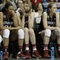 Stanford&#39;s Erica McCall, Taylor Greenfield and Karlie Samuelson, from left, sit on the bench  during the second half of the semifinal game against Connecticut in the Final Four of the NCAA women&#39;s college basketball tournament, Sunday, April 6, 2014, in Nashville, Tenn. Connecticut won 75.56. (AP Photo/Mark Humphrey)