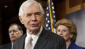 ** FILE ** This Feb. 4, 2014, file photo shows Sen. Thad Cochran, R-Miss, center, speaking during a news conference on Capitol Hill in Washington. (AP Photo/J. Scott Applewhite, File)