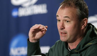 FILE - In this March 21, 2014 file photo, North Dakota State head coach Saul Phillips speaks at a news conference before the third round of the NCAA men&#39;s college basketball tournament in Spokane, Wash. Ohio University announced Sunday, April 6, 2014, it had hired Phillips , who led NDSU to a record-tying 26 wins this past season and a trip to the NCAA Tournament. (AP Photo/Elaine Thompson, File)