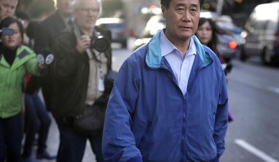 ** FILE ** In this March 26, 2014, file photo, California state Sen. Leland Yee, D-San Francisco, right, leaves the San Francisco Federal Building in San Francisco. (AP Photo/Ben Margot, File)