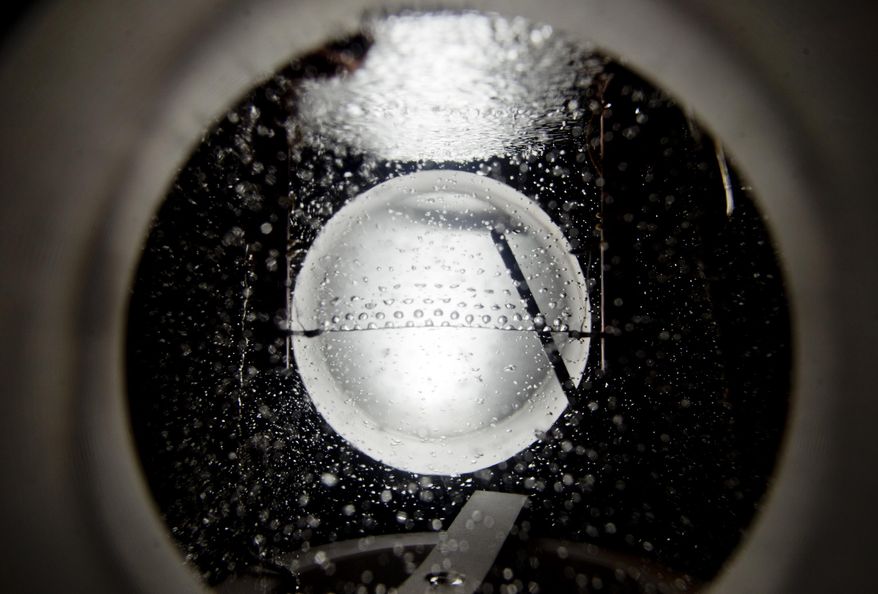 Bubbles role off a platinum wire in unison in what is called a "transition to nucleate boiling" experiment in Pablo Carrica's Experimental Engineering course held at the University of Iowa Seamans Center for the Engineering Arts and Sciences in Iowa City on March 27, 2014. In the past 10 years, UI's College of Engineering has grown 70 percent — 30 percent in the past four years alone. Of those graduating, 98 percent leave school with jobs that have a median starting salary of more than $60,000. (AP Photo/Iowa City Press-Citizen, Benjamin Roberts) NO SALES