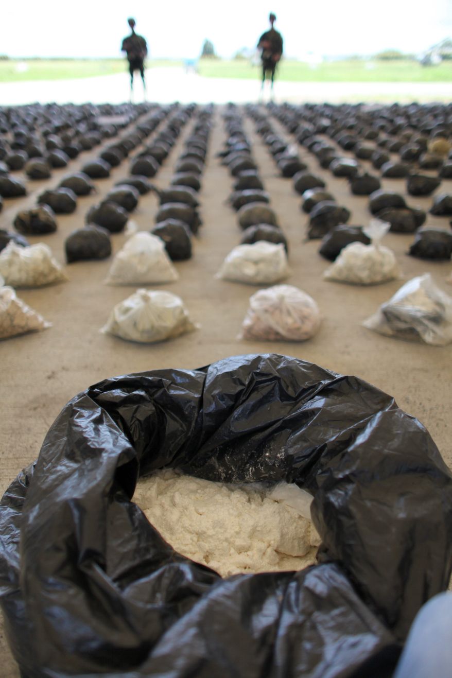 Rebel Loot: Soldiers in Tumaco guard 3.9 tons of cocaine seized from the Revolutionary Armed Forces of Colombia. Tumaco has Colombia&#39;s highest concentration of cultivation of coca. (ASSOCIATED PRESS)