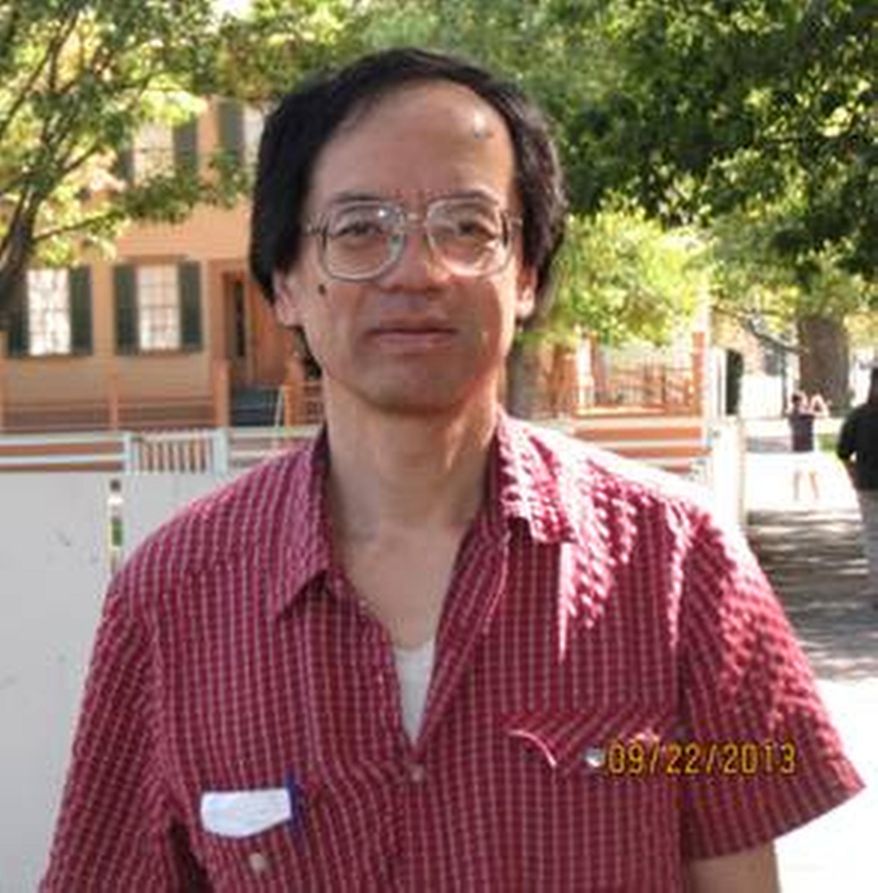 In this Aug. 22, 2013 photo provided by the Kalamazoo Police Department, Takashi Sugimori is shown. Sugimori, a man missing at a Kalamazoo, Mich., area lake, has been identified as the husband of a Kalamazoo College professor. College President Eileen Wilson-Oyelaran says the school is "doing all it can" to support the family. Police believe Sugimori may have fallen through ice at Asylum Lake. He planned to go cross-country skiing and hasn't been seen since Wednesday, April 2, 2014. (AP Photo/Kalamazoo Police Department)