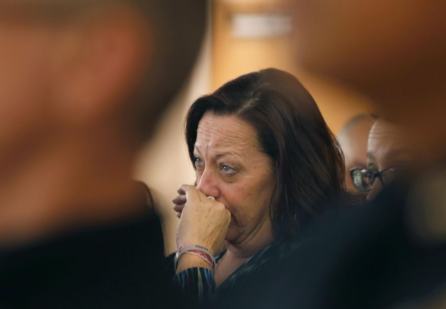 In this Thursday, Feb. 20, 2014 photo, Karen Lewis listens to her son, Cody, a recovering heroin addict, talk abut his life and addiction at the Good Samaritan Methodist Church in Addison, Ill. Though she tried different approaches - punishment, lectures, praise when he entered rehab - nothing stuck. About a month after his release from a court-ordered 8½-month residential treatment program, Cody reverted to his old ways. &amp;quot;I just gave in when I got out,&amp;quot; he says. &amp;quot;You can learn every trick in the book to prevent you from using, but you have to use what they teach you.&amp;quot; (AP Photo/Charles Rex Arbogast)