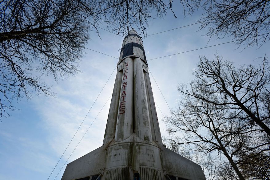 This April 2, 2014 photo shows the Saturn 1B Rocket at the Alabama Welcome Center on Interstate 65 on April 2, 2014 in Ardmore, Ala. The paint is faded, and black mold and algae cover the bottom. Birds use the rocket's crevices for nests, and their droppings are everywhere. The U.S. Space and Rocket Center in Huntsville is working with the Alabama Department of Transportation to get it pressure-washed and painted this summer. The state Tourism Department will fund the project. (AP Photo/The Decatur Daily, Gary Cosby Jr.)