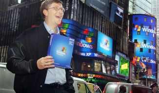 FILE - In this Oct. 25, 2001 file photo, Microsoft chairman Bill Gates stands in New York&#x27;s Times Square to promote the new Windows XP operating system. On Tuesday, April 8, 2014, Microsoft will end support for its still popular Windows XP. With an estimated 30 percent of businesses and consumers still using the 12-year-old operating system, the move could put everything from the data of major financial institutions to the identities of everyday people in danger if they don’t find a way to upgrade soon. (AP Photo/Richard Drew, File)
