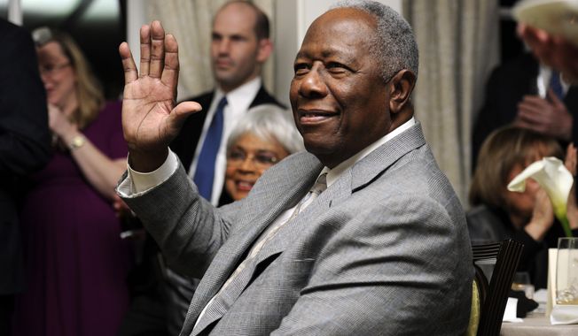 FILE - In this  Feb. 7, 2014 file photo, baseball Hall of Famer Hank Aaron waves during a reception in his honor in Washington. The 40th anniversary of Hank Aaron&#x27;s 715th home run finds the Hall of Famer, now 80, coping with his recovery from hip surgery. The anniversary of his famous homer on April 8, 1974 will be celebrated before the Braves&#x27; home opener against the Mets on Tuesday night. (AP Photo/Nick Wass, File)