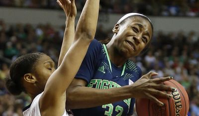 Notre Dame guard Jewell Loyd (32) collides into Connecticut guard Moriah Jefferson (4) during the first half of the championship game in the Final Four of the NCAA women&#x27;s college basketball tournament, Tuesday, April 8, 2014, in Nashville, Tenn. (AP Photo/John Bazemore)