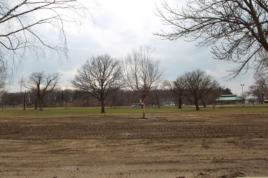 This photo taken on Monday, April 7, 2014, shows Iowa City's City Park in Iowa City, Iowa. Officials in Iowa City are seeking ideas to redesign the popular park after flooding last summer left it strewn with sand and debris. (AP Photo/Iowa City Press-Citizen, David Scrivner) NO SALES