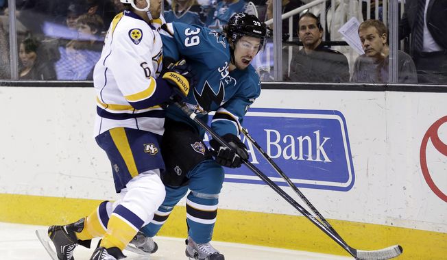 San Jose Sharks&#x27; Logan Couture, right, is defended by Nashville Predators&#x27; Shea Weber during the first period of an NHL hockey game Saturday, April 5, 2014, in San Jose, Calif. (AP Photo/Marcio Jose Sanchez)