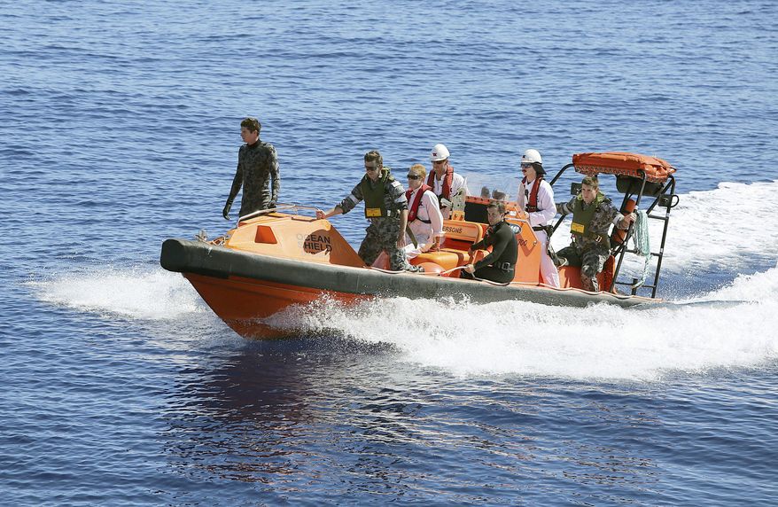 In this April 7, 2014 photo provided by the Australian Defense Force a fast response craft manned by members from the Australian Defense's ship Ocean Shield is deployed to scan the water for debris of missing Malaysia Airlines Flight 370 in the southern Indian Ocean. Up to 14 planes and as many ships were focusing on a single search area covering 77, 580 square kilometers (29,954 square miles) of ocean, 2,270 kilometers (1,400 miles) northwest of the Australian west coast city of Perth, Australia. (AP Photo/Australia Defense Force, LSIS Bradley Darvill) EDITORIAL USE ONLY