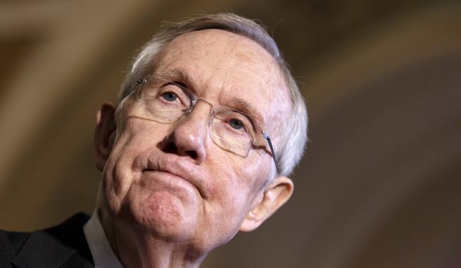 Senate Majority Leader Harry Reid of Nev. pauses during a news conference on Capitol Hill in Washington, Tuesday, April 8, 2014, to call attention to the gender pay gap as the Senate begins debate on wage equity. (AP Photo/J. Scott Applewhite)