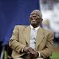 Hank Aaron laughs during a ceremony celebrating the 40th anniversary of his 715th home run before the start of a baseball game between the Atlanta Braves and the New York Mets, Tuesday, April 8, 2014, in Atlanta. (AP Photo/David Goldman)