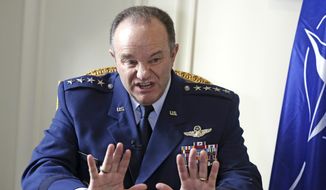 NATO Supreme Allied Commander Europe, U.S. Air Force General Philip Breedlove gestures during an interview with the Associated Press in Paris, Wednesday April 9, 2014, as he talks about his mission to formulate a plan to help protect and reassure NATO members nearest Russia. NATO’s top military commander in Europe, Breedlove is tasked with drafting countermoves to the perceived Russian military threat against Ukraine. (AP Photo/Remy de la Mauviniere)