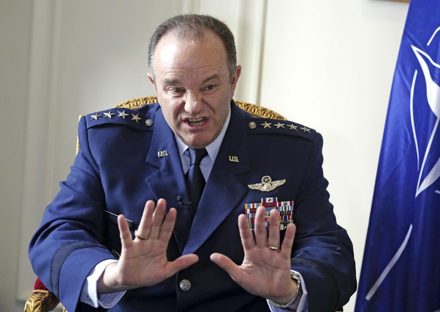 NATO Supreme Allied Commander Europe, U.S. Air Force General Philip Breedlove gestures during an interview with the Associated Press in Paris, Wednesday April 9, 2014, as he talks about his mission to formulate a plan to help protect and reassure NATO members nearest Russia. NATO’s top military commander in Europe, Breedlove is tasked with drafting countermoves to the perceived Russian military threat against Ukraine. (AP Photo/Remy de la Mauviniere)