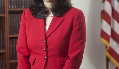 In this 2013 photo, U.S. District Judge Lucy Koh poses for a picture, in San Francisco. Koh has become increasingly frustrated during the first few days of the trial pitting Apple against Samsung because personal Wi-Fi signals interfere with an internal network she relies on for a real-time transcript of the proceedings. (AP Photo/The Recorder, Jason Doiy)