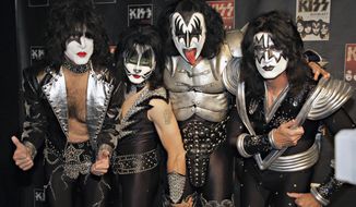** FILE ** In this May 8, 2008, file photo, members of Kiss, from left, Paul Stanley, Eric Singer, Gene Simmons and Tommy Thayer, poses for a photograph during a news conference to promote the start of their KISS Alive/35 European Tour in Oberhausen, Germany. (AP Photo/Volker Wiciok, file)