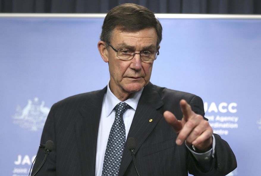 The chief coordinator of the Joint Agency Coordination Center Retired Australian Air Chief Marshal Angus Houston gestures as he speaks at a press conference about the ongoing search operations for missing Malaysia Airlines Flight 370 in Perth, Australia, Wednesday, April 9, 2014. Houston said a ship searching for the missing Malaysian jet has detected two more underwater signals that may be emanating from the aircraft's black boxes, and expressed hope Wednesday that the plane's wreckage will soon be found. (AP Photo/Rob Griffith)