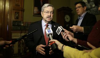Iowa Gov. Terry Branstad speaks to reporters outside his formal office, Wednesday, April 9, 2014, at the Statehouse in Des Moines, Iowa. Branstad, who fired Iowa Department of Administrative Services director Mike Carroll on Tuesday, says he&#39;s confident his interim director will protect records and will thoroughly review the staff to ensure the agency functions properly. (AP Photo/Charlie Neibergall)