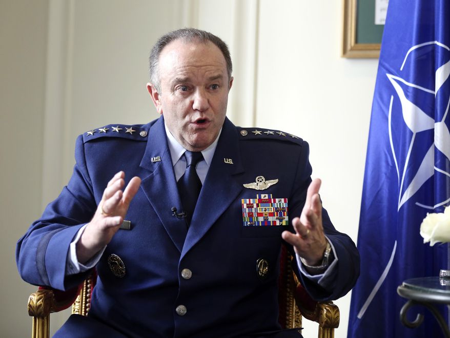 NATO Supreme Allied Commander Europe, U.S. Air Force General Philip Breedlove gestures during an interview with the Associated Press in Paris, Wednesday April 9, 2014, as he talks about his mission to formulate a plan to help protect and reassure NATO members nearest Russia. NATO’s top military commander in Europe, Breedlove is tasked with drafting countermoves to the Russian military threat against Ukraine. (AP Photo/Remy de la Mauviniere)