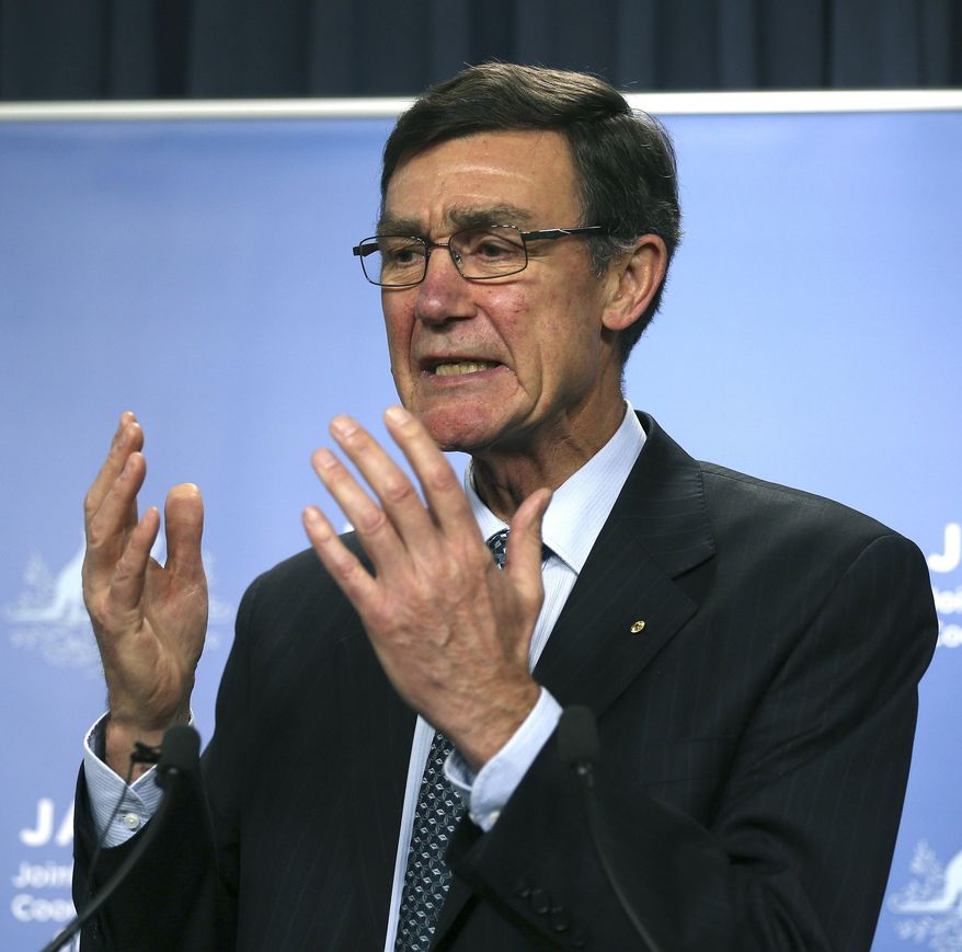 The chief coordinator of the Joint Agency Coordination Center Retired Australian Air Chief Marshal Angus Houston gestures as he speaks at a press conference about the ongoing search operations for missing Malaysia Airlines Flight 370 in Perth, Australia, Wednesday, April 9, 2014. Houston said a ship searching for the missing Malaysian jet has detected two more underwater signals that may be emanating from the aircraft's black boxes, and expressed hope Wednesday that the plane's wreckage will soon be found. (AP Photo/Rob Griffith)