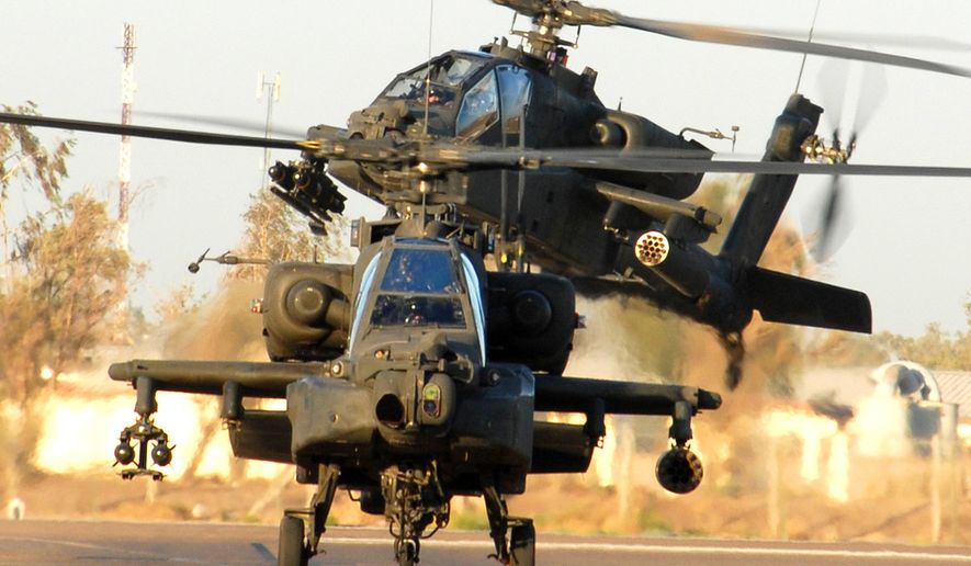The DOJ has accused four men of stealing $100 million worth of information from Microsoft Corporation and simulator software used to train Apache attack helicopter pilots. (U.S. Army photo by CW4 Daniel McClinton, 1-227th, 1st ACB, 1st Cav. Div. Public Affairs)