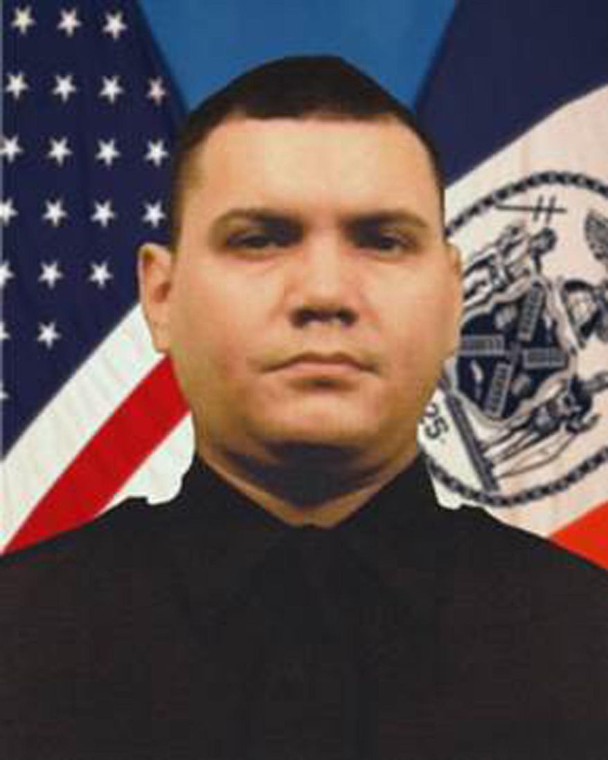 This undated photo provided by the New York City Police Department shows Officer Dennis Guerra. Guerra died, Wednesday, April 9, 2014 after responding to a mattress fire Sunday at a Brooklyn apartment building. Mayor Bill de Blasio says New York City is "hurting" after the death of Guerra, and praised him as an "exemplary" officer who was trying to "save people in need." (AP Photo/NYPD)