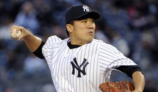 New York Yankees&#x27; Masahiro Tanaka pitches during the first inning of a baseball game against the Baltimore Orioles on Wednesday, April 9, 2014, at Yankee Stadium in New York. (AP Photo/Bill Kostroun)