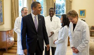 President Barack Obama shares a humorous moment with a group of doctors from around the country in the Oval Office, Oct. 5, 2009, prior to a health insurance reform event at the White House.
(Official White House Photo by Pete Souza)
